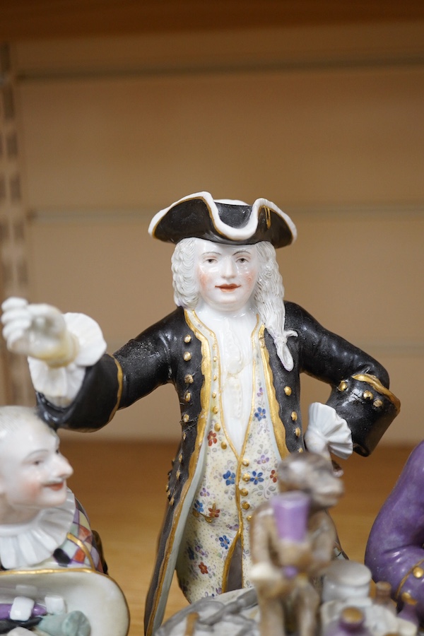 A 19th century Meissen group of The Dentist, outside decorated, incised model no. 186, 21cm. Condition - broken and restored